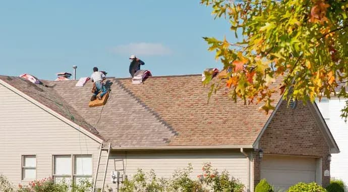 Roofers working on a Los Angeles home by So Cal Builders & Design